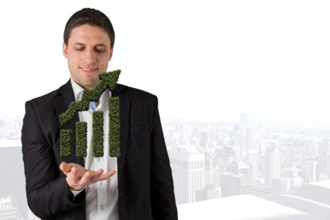 Man with a bar graph grass in hands